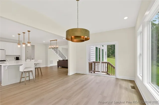 a view of an entryway with wooden floor