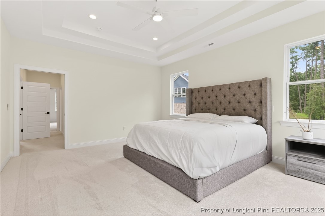 197 Silverside Drive Angier, NC 27501 - Photo 29 of 48 a bed room with a bed and a large window