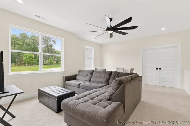 a living room with furniture and a window
