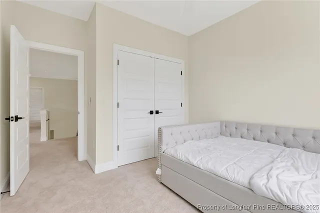 a bedroom with a bed and a bathroom