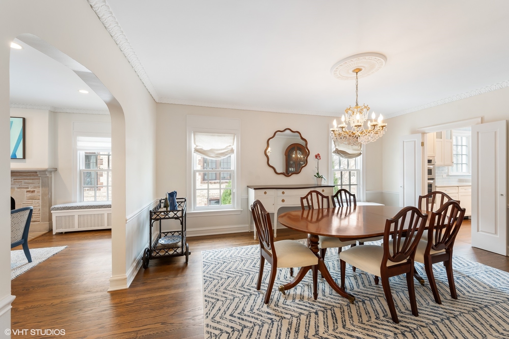 221 Church Road Winnetka, IL 60093 - Photo 12 of 42 a view of a dining room with furniture a chandelier and wooden floor