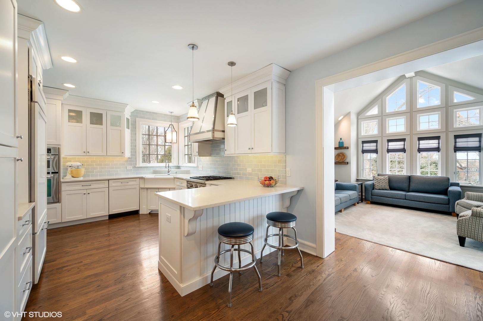 221 Church Road Winnetka, IL 60093 - Photo 14 of 42 a kitchen with white cabinets and chairs