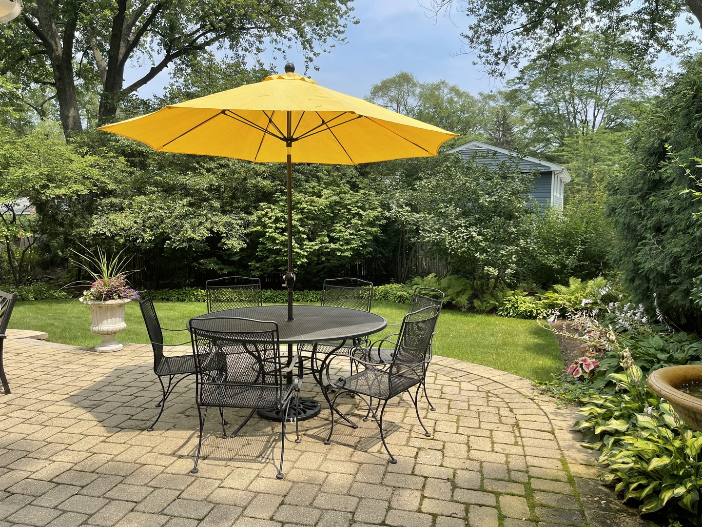 221 Church Road Winnetka, IL 60093 - Photo 20 of 42 a view of a backyard with a patio and outdoor seating