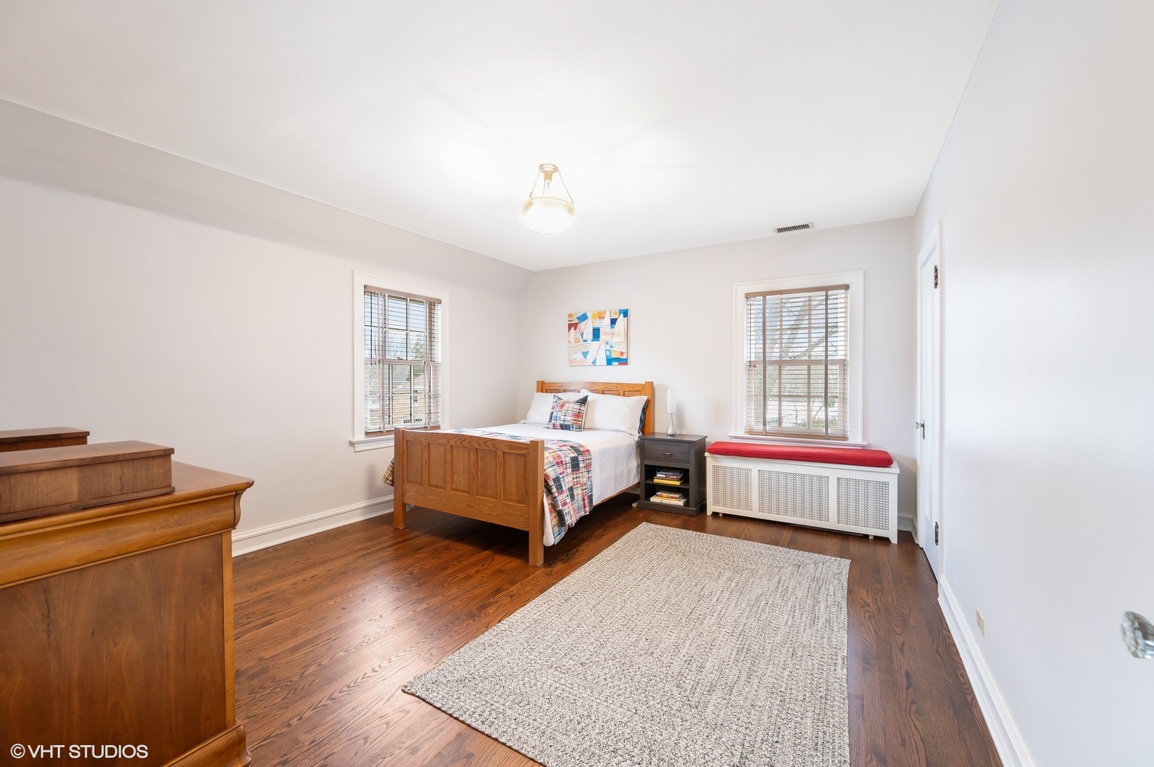 221 Church Road Winnetka, IL 60093 - Photo 28 of 42 a bedroom with a bed and wooden floor