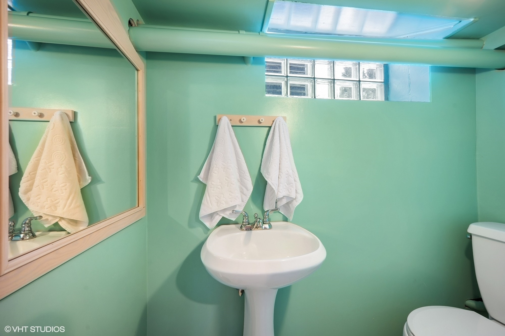 221 Church Road Winnetka, IL 60093 - Photo 37 of 42 a bathroom with a sink and a mirror