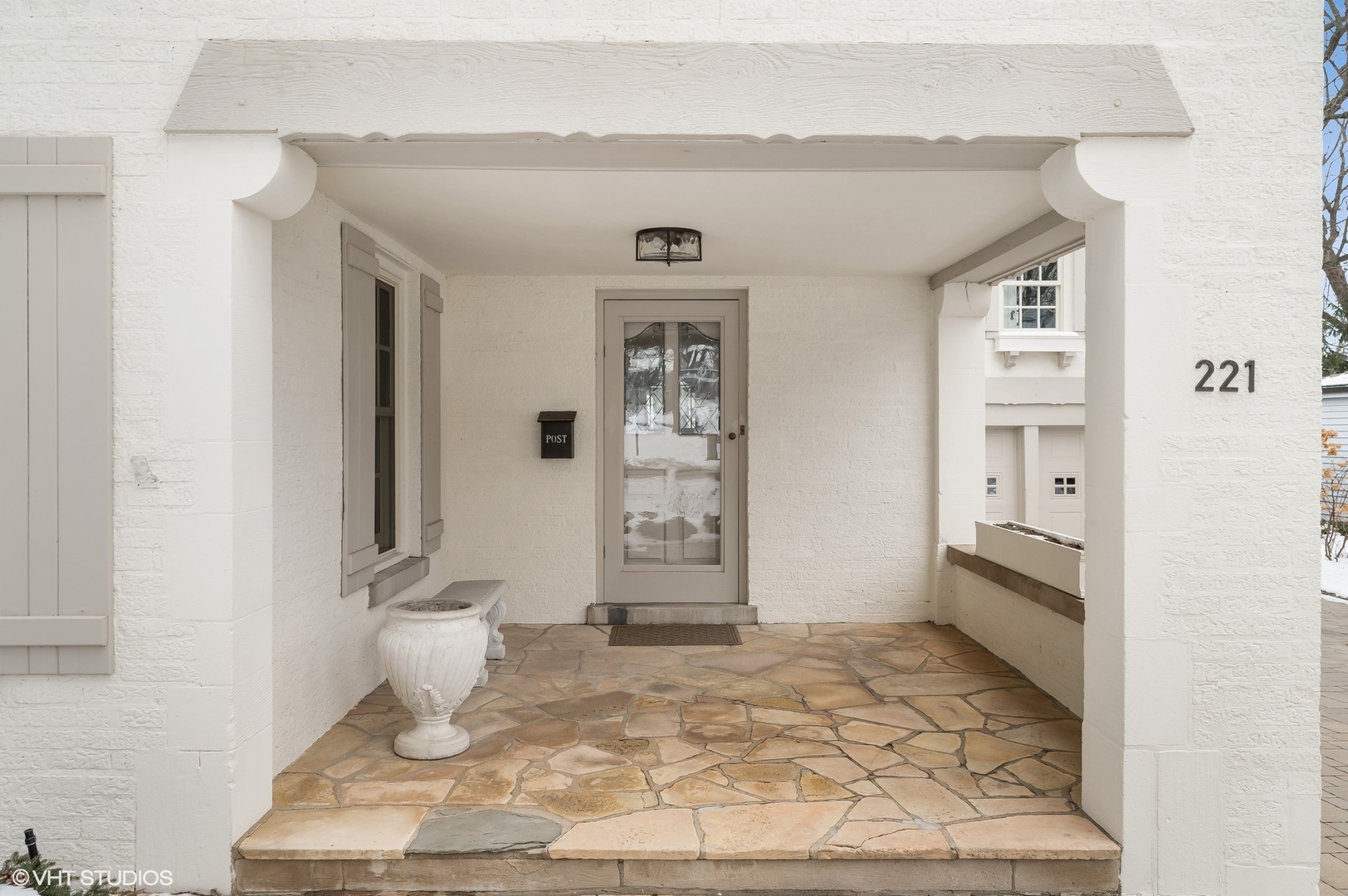 221 Church Road Winnetka, IL 60093 - Photo 4 of 42 a view of a hallway with wooden floor and dining room