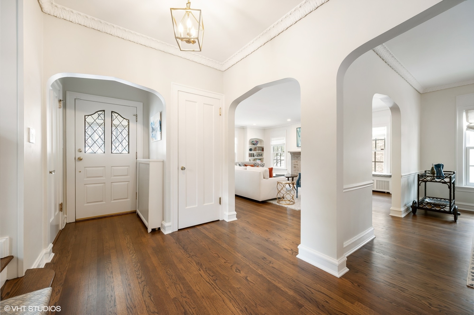 221 Church Road Winnetka, IL 60093 - Photo 7 of 42 a view of a livingroom with wooden floor and a bathroom