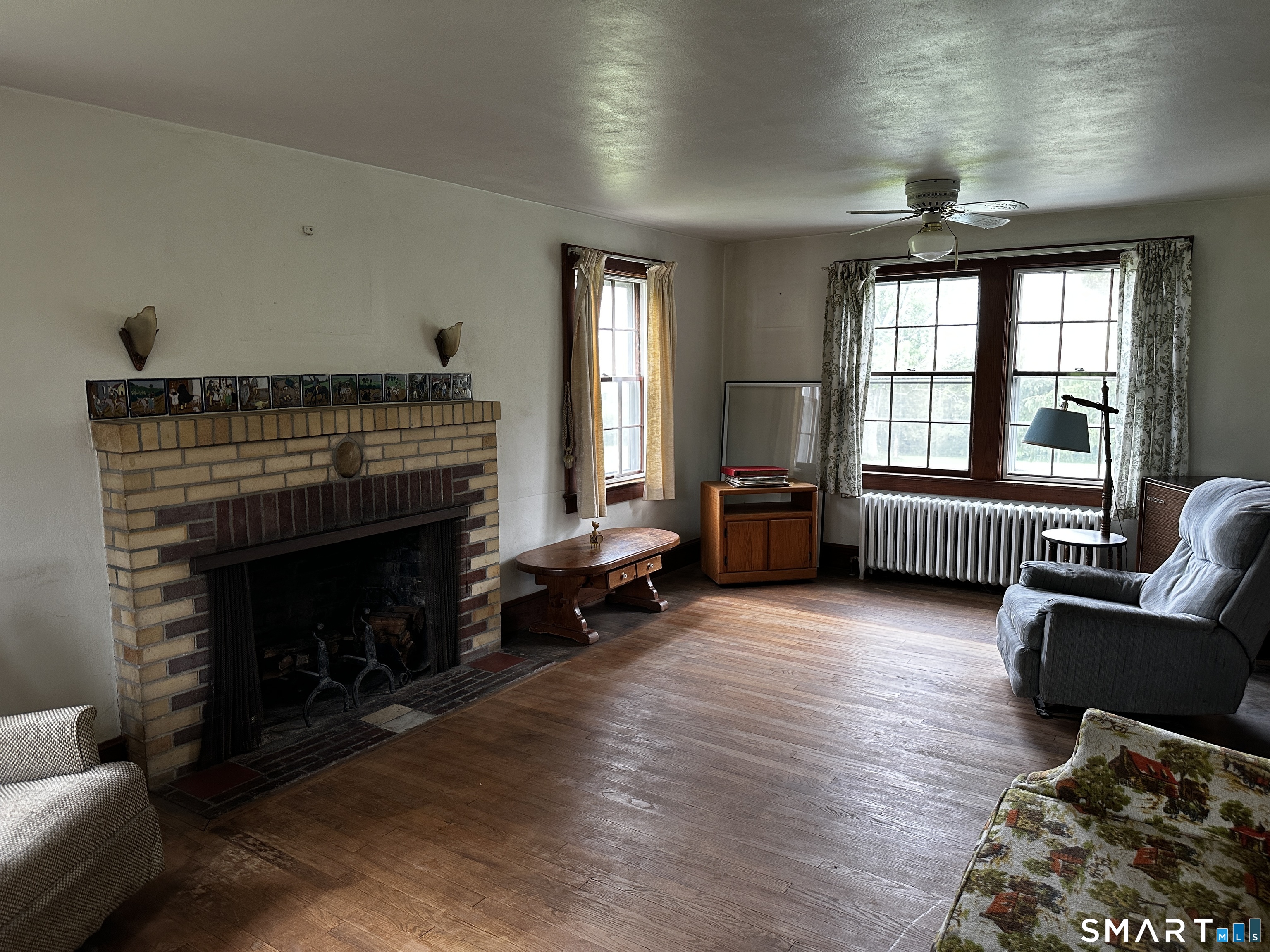 400 Gay Street Sharon, CT 06069 - Photo 11 of 11 a living room with furniture and a fireplace