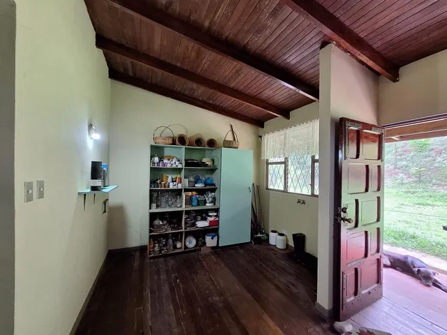 a view of a livingroom with furniture and staircase
