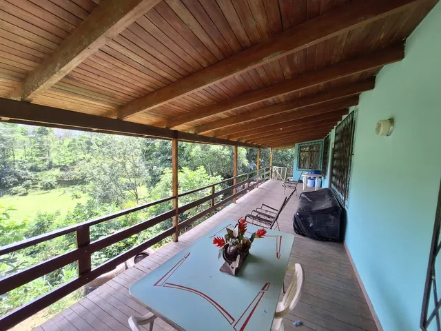 a view of two chairs in the balcony
