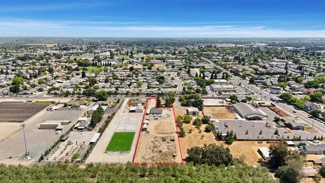 an aerial view of residential building and parking space