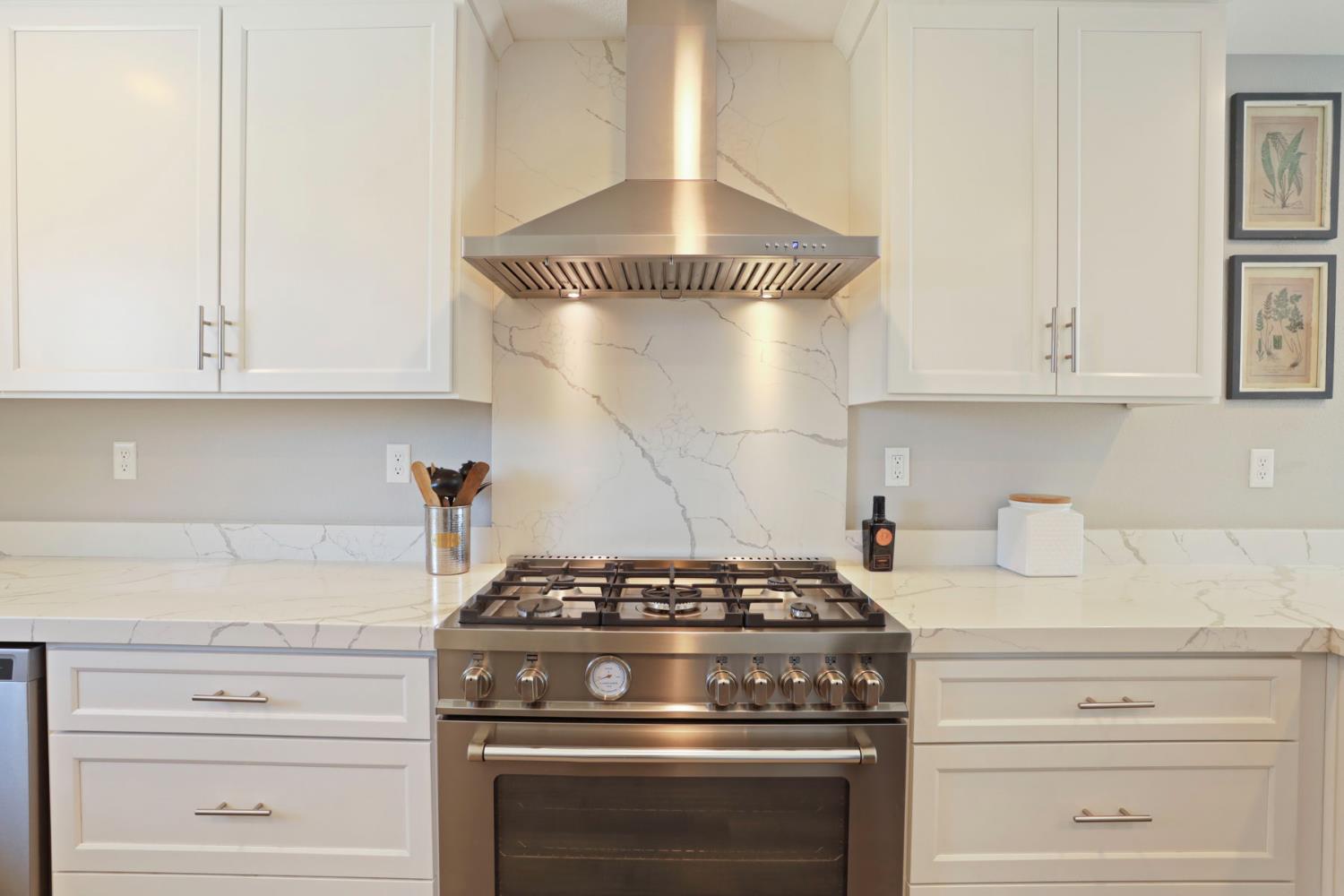 23811 South Jack Tone Road Ripon, CA 95366 - Photo 23 of 51 a stove top oven sitting inside of a kitchen