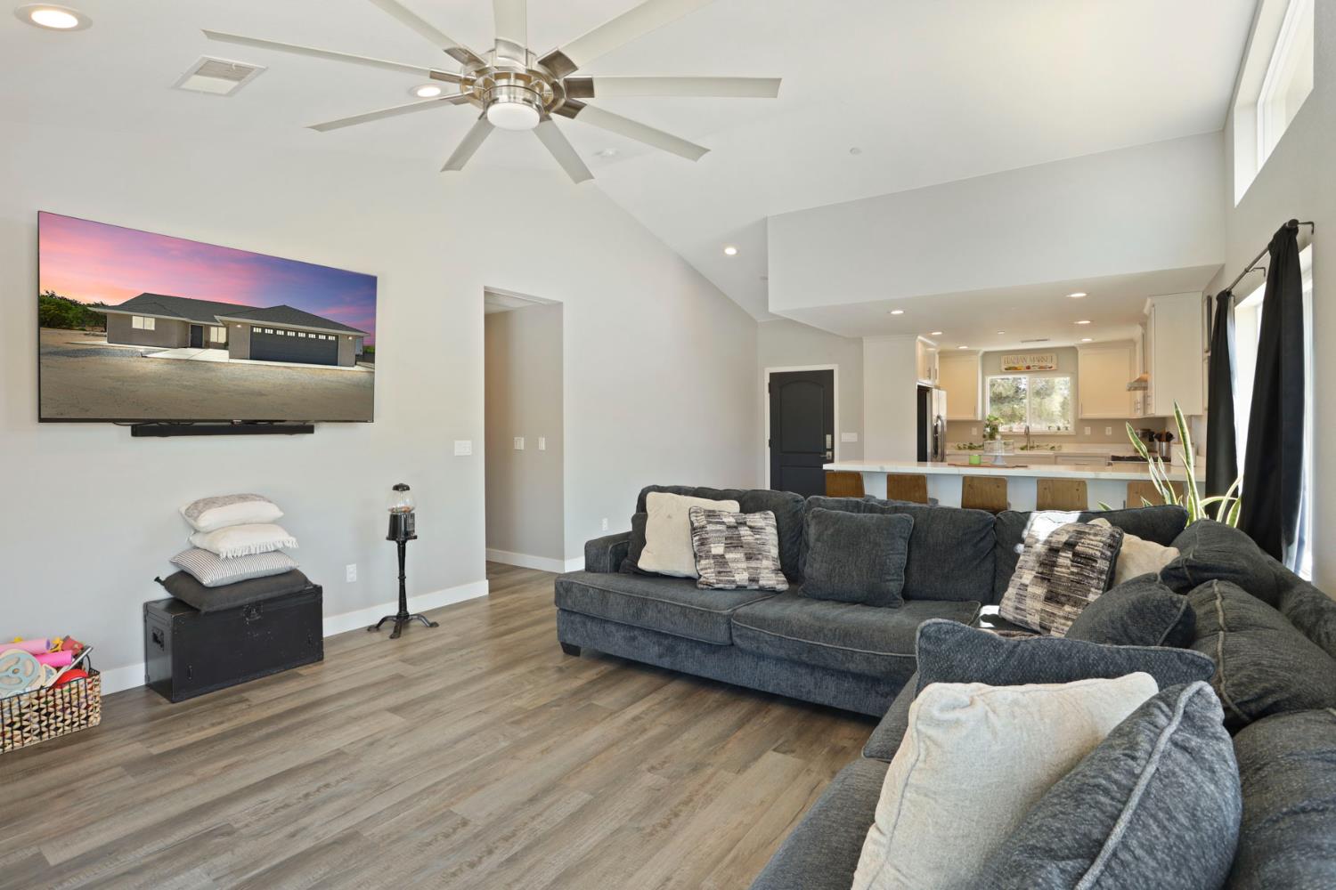 23811 South Jack Tone Road Ripon, CA 95366 - Photo 26 of 51 a living room with furniture and a flat screen tv