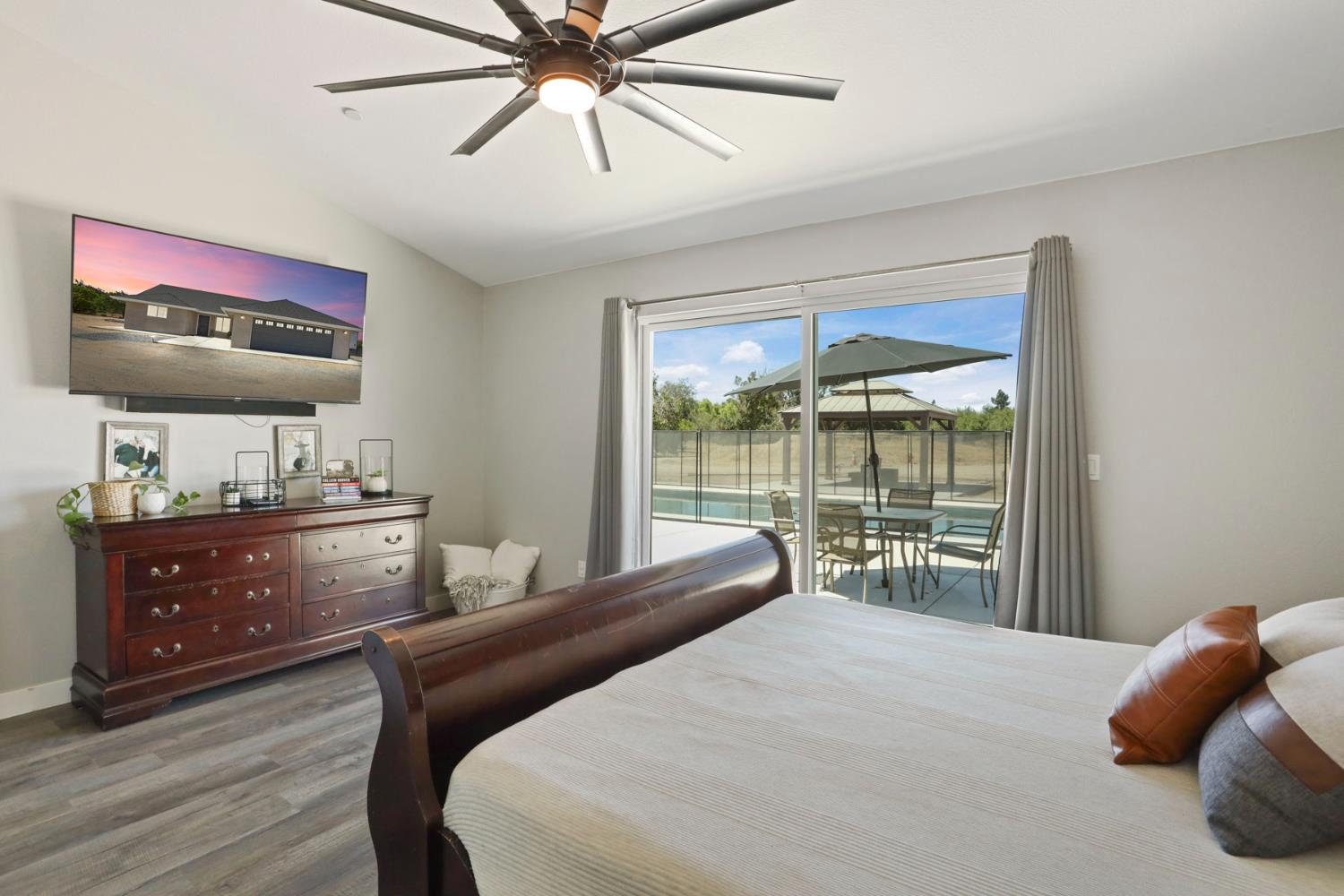 23811 South Jack Tone Road Ripon, CA 95366 - Photo 34 of 51 a bedroom with a bed and a window