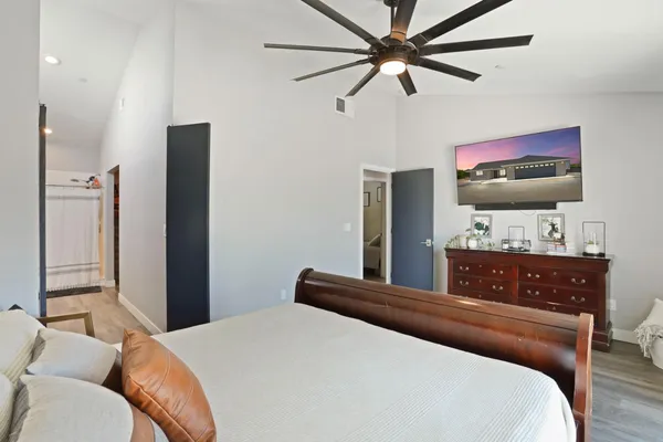 a bedroom with a bed and window