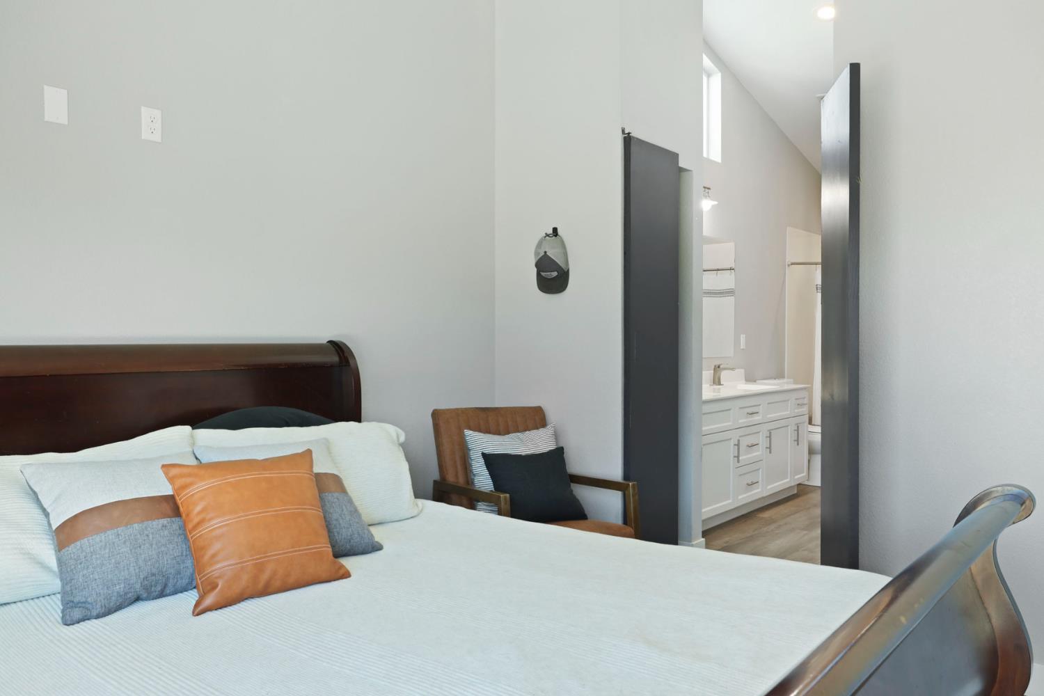 23811 South Jack Tone Road Ripon, CA 95366 - Photo 36 of 51 a bedroom with a bed and window