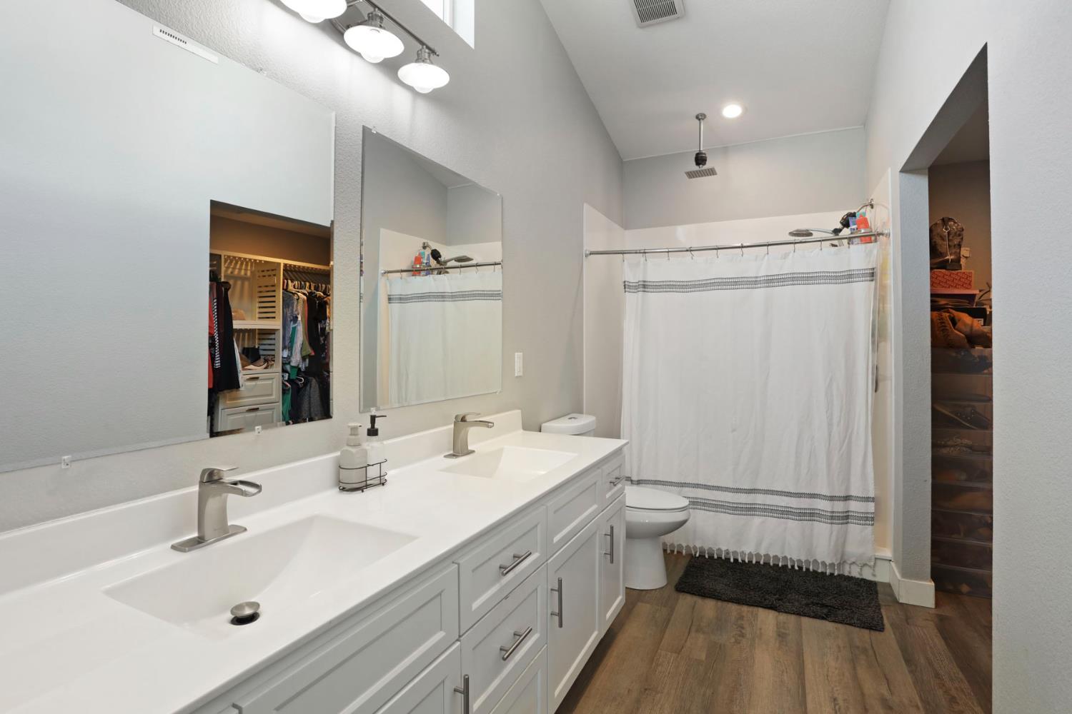 23811 South Jack Tone Road Ripon, CA 95366 - Photo 37 of 51 a bathroom with a sink a toilet and shower