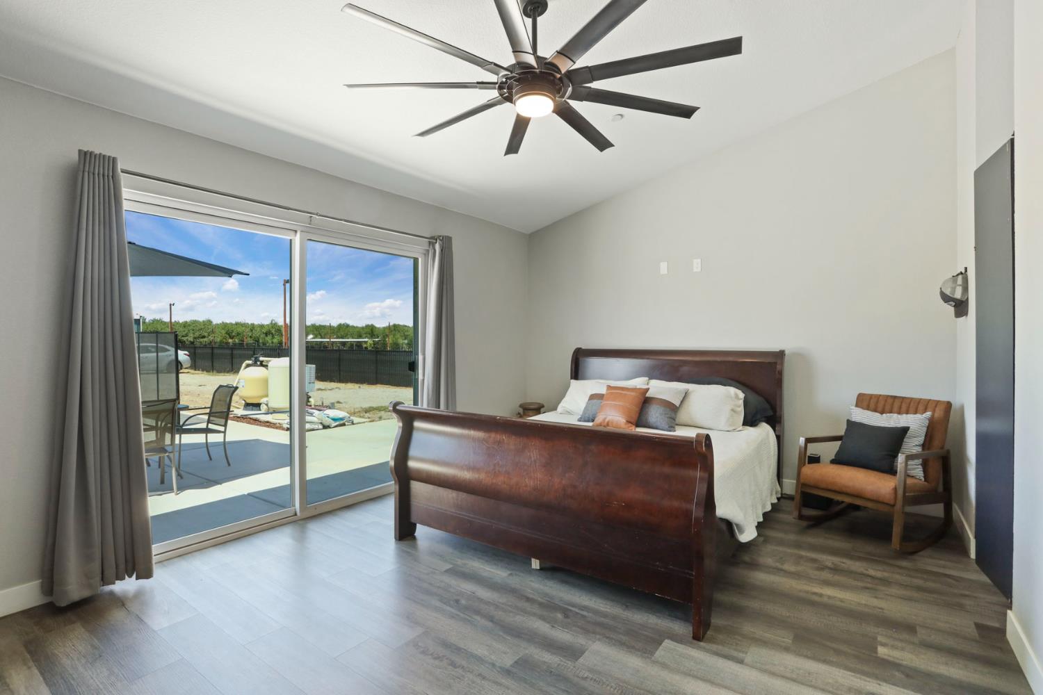 23811 South Jack Tone Road Ripon, CA 95366 - Photo 39 of 51 a bedroom with a bed and a couch