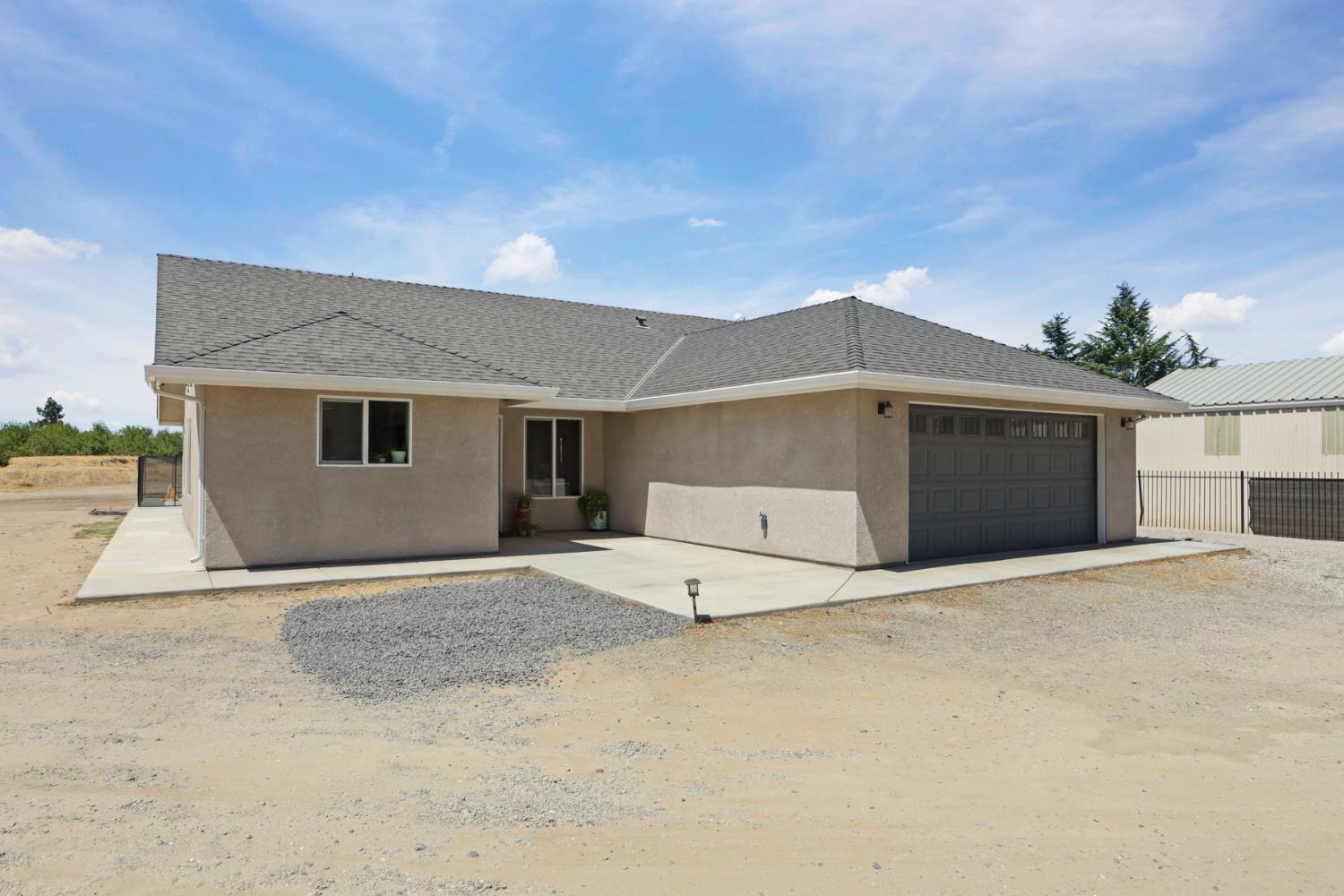 23811 South Jack Tone Road Ripon, CA 95366 - Photo 6 of 51 a view of a house with a garage