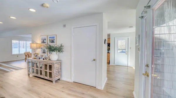 a view of an entryway wooden floor and wooden floor