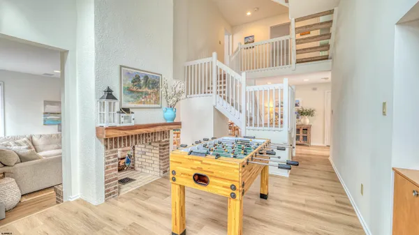 a bedroom with a bed and windows