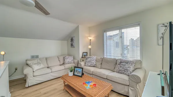a bedroom with furniture and window