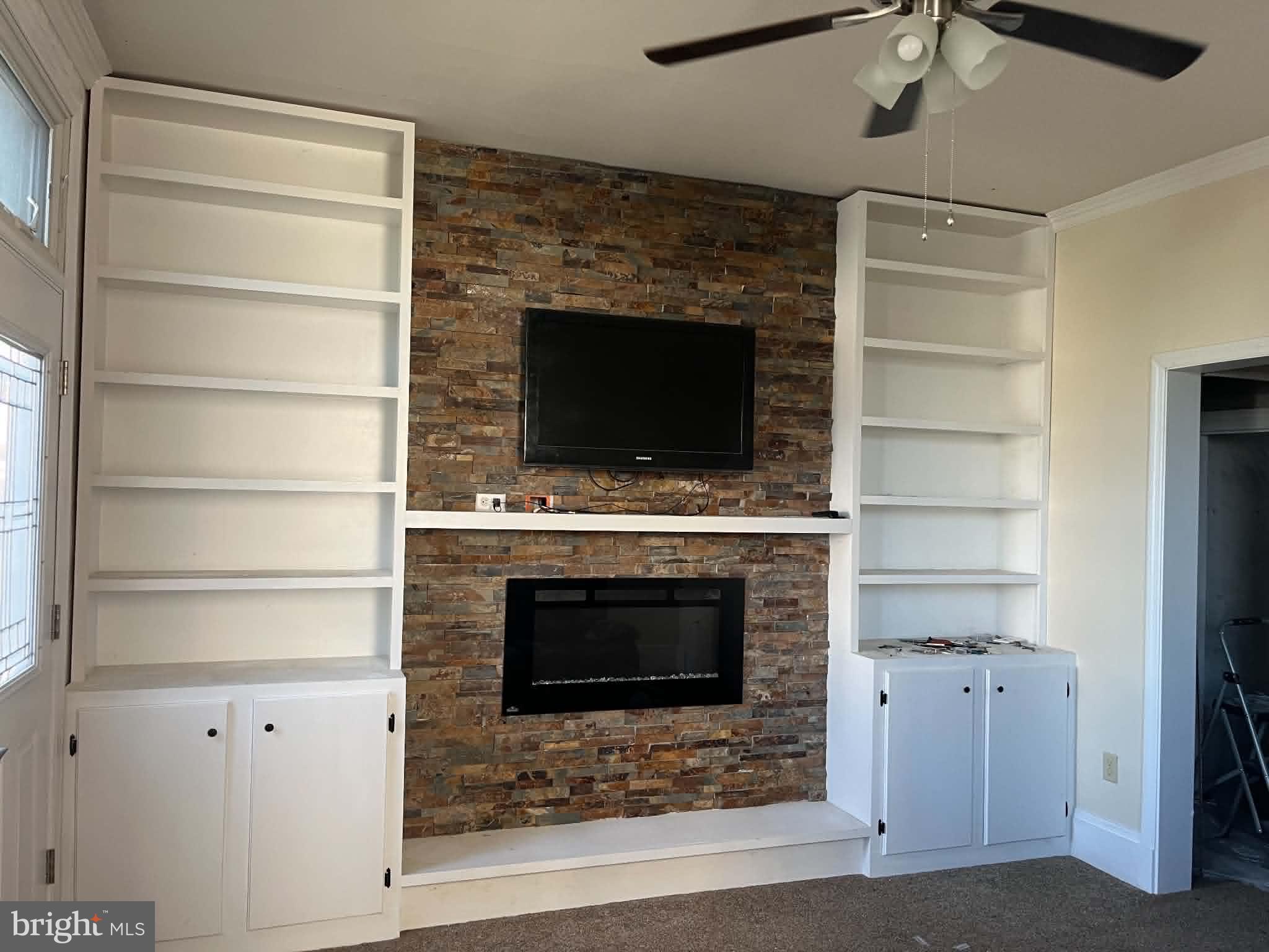 533 North Reading Avenue Boyertown, PA 19512 - Photo 9 of 22 Built-in bookcases, electric fireplace and tv