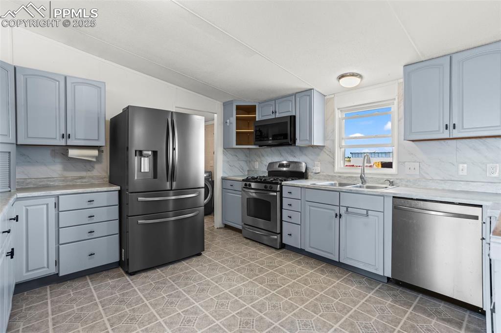 7855 Edison Road Yoder, CO 80864 - Photo 3 of 16 a kitchen with granite countertop a stainless steel appliances and cabinets