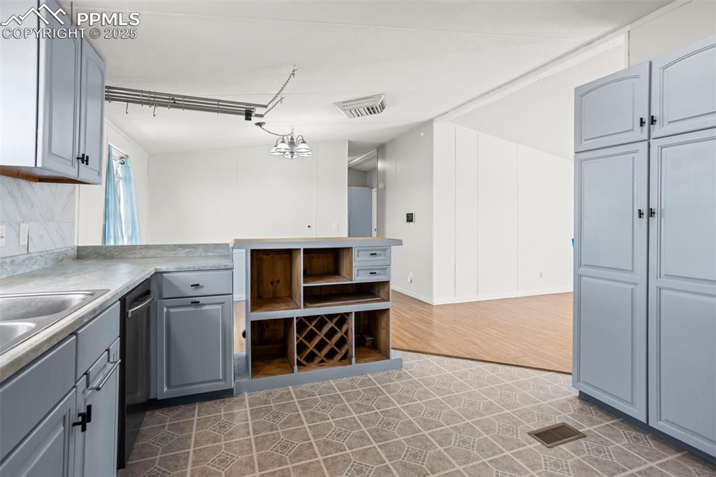 7855 Edison Road Yoder, CO 80864 - Photo 5 of 16 a kitchen with stainless steel appliances a stove and a refrigerator