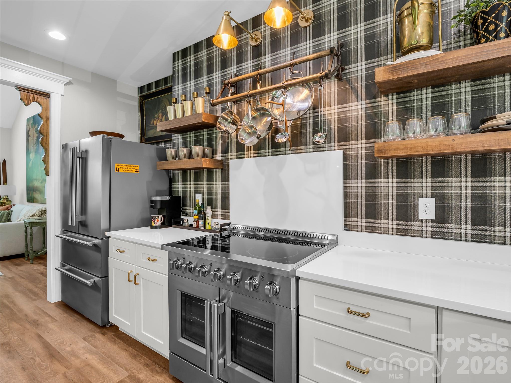 737 Melrose Mountain Road Tryon, NC 28782 - Photo 16 of 42 a kitchen with a stove and a refrigerator