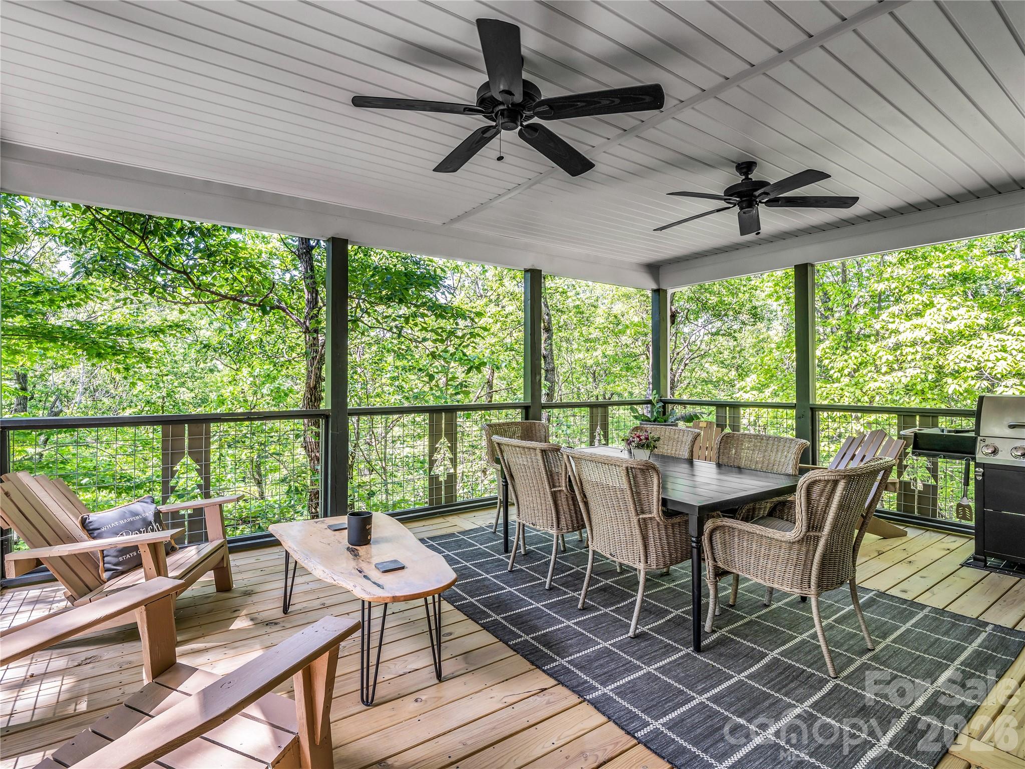 737 Melrose Mountain Road Tryon, NC 28782 - Photo 19 of 42 a dining room with furniture window and outside view