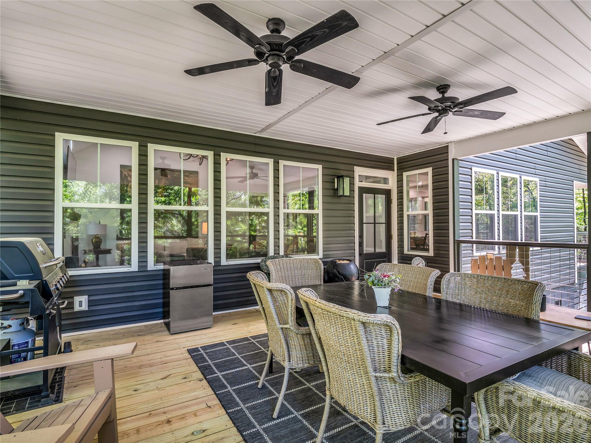737 Melrose Mountain Road Tryon, NC 28782 - Photo 20 of 42 a view of a dining room with furniture window and outside view