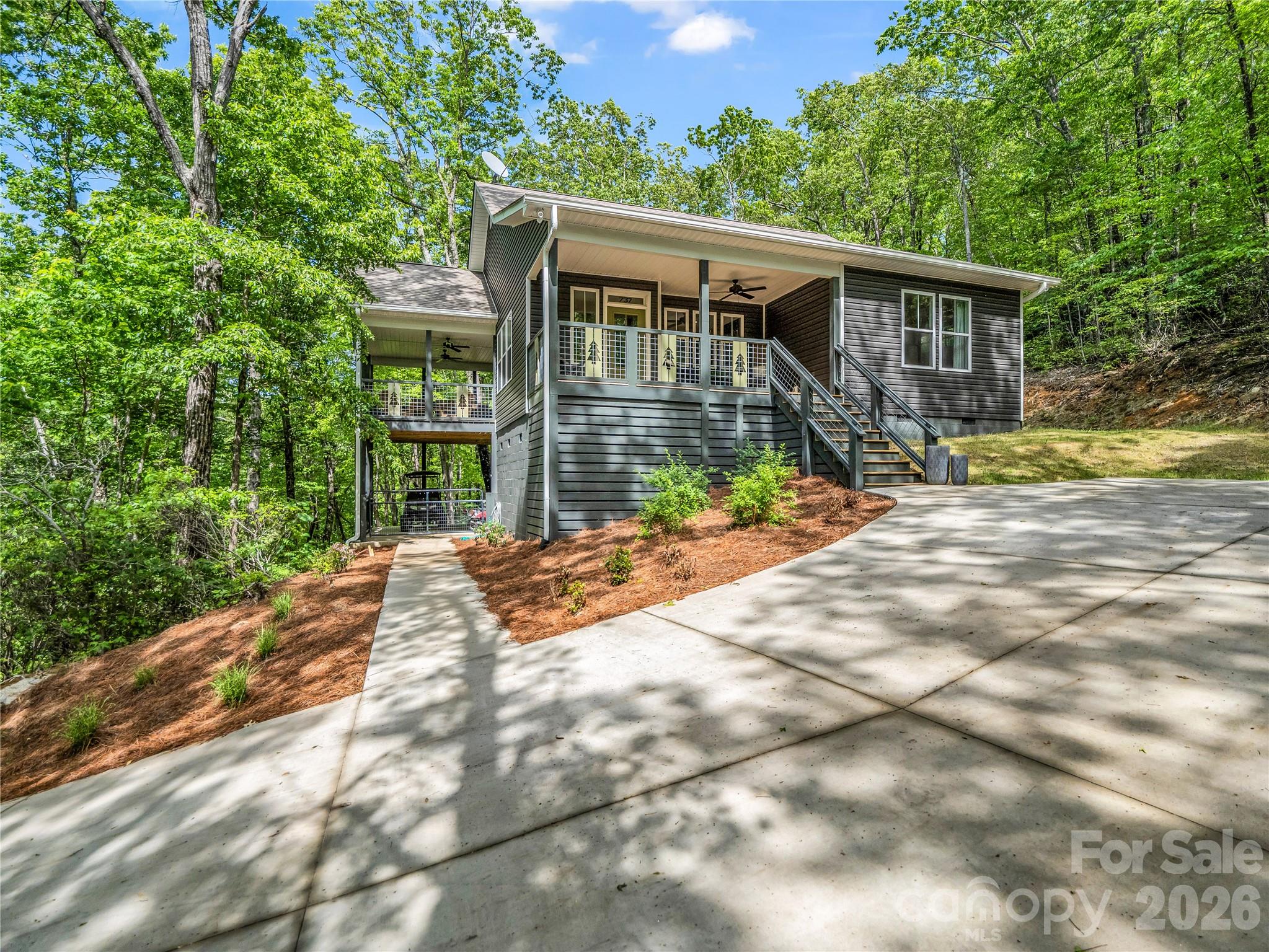 737 Melrose Mountain Road Tryon, NC 28782 - Photo 2 of 42 a view of a house with a yard
