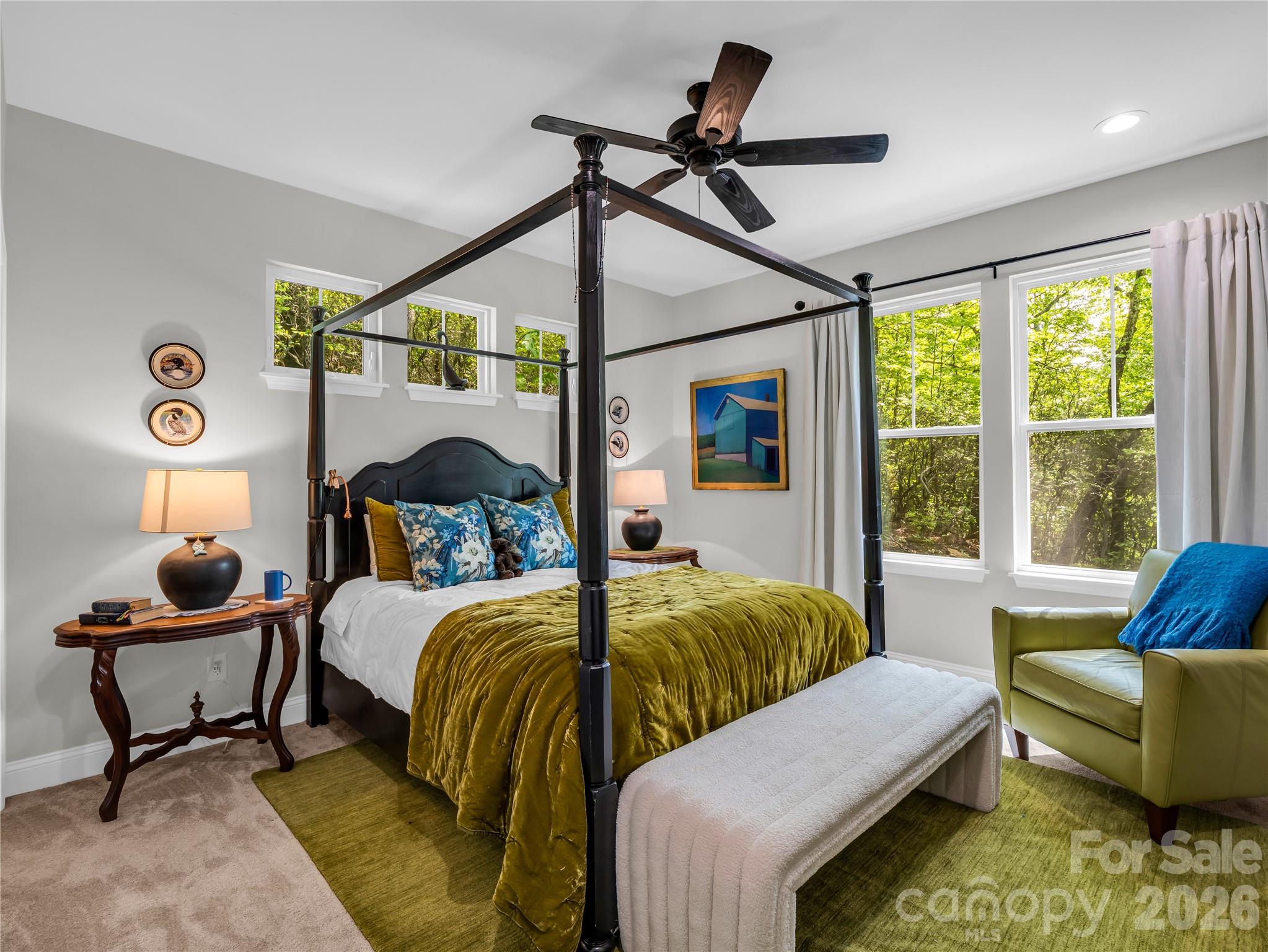 737 Melrose Mountain Road Tryon, NC 28782 - Photo 21 of 42 a bedroom with a bed window and couch