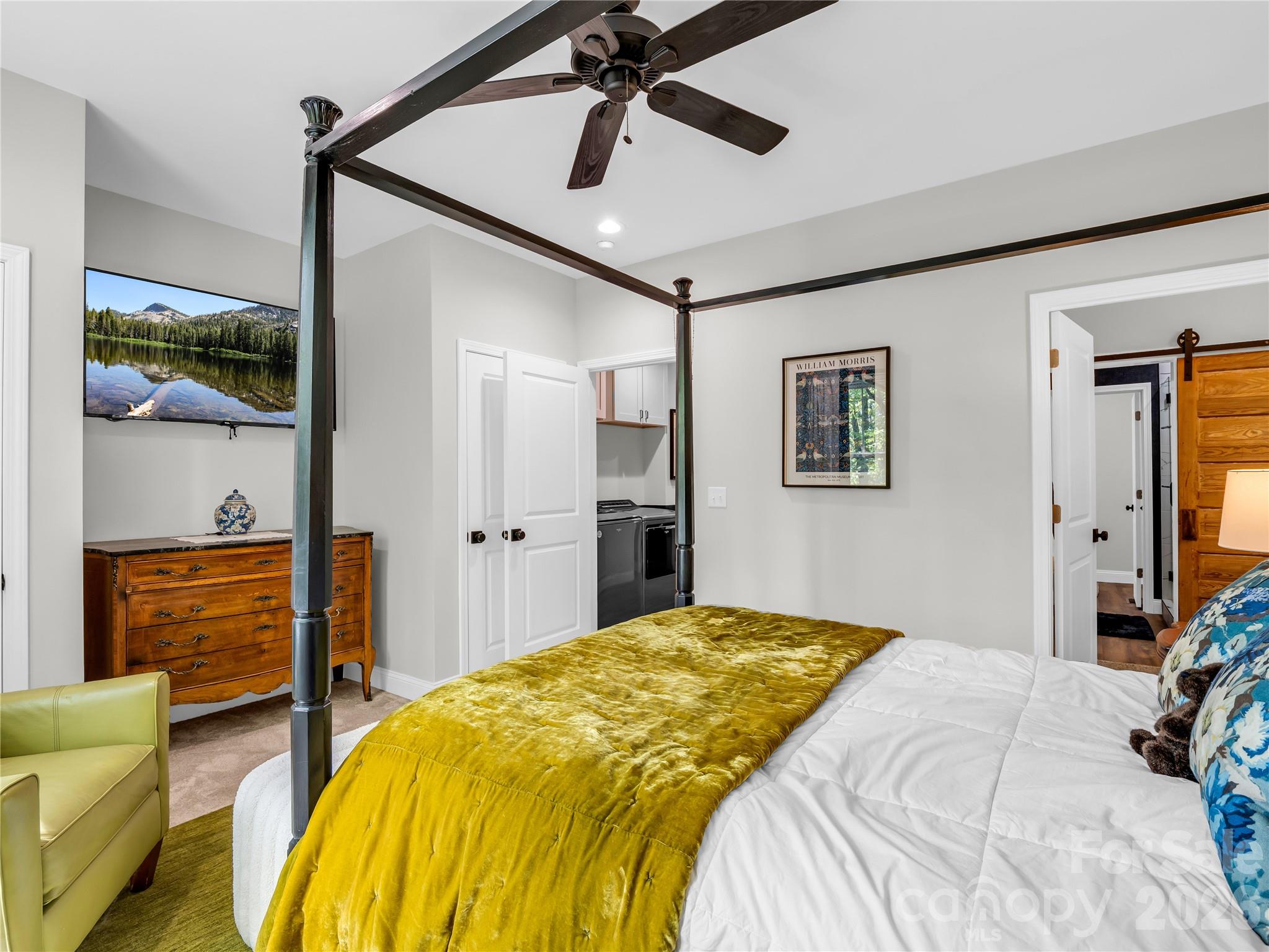 737 Melrose Mountain Road Tryon, NC 28782 - Photo 22 of 42 a bedroom with a bed and a dresser
