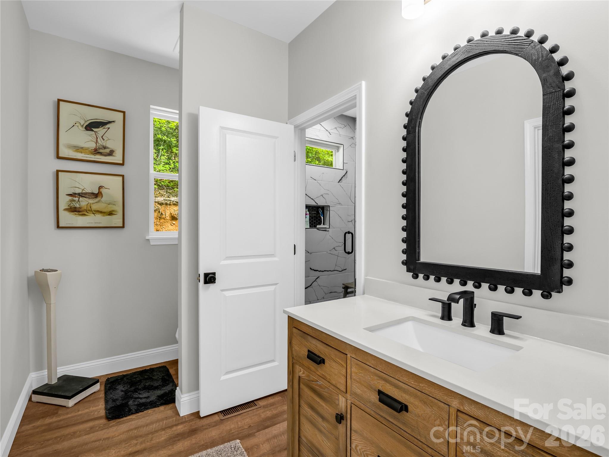 737 Melrose Mountain Road Tryon, NC 28782 - Photo 25 of 42 a bathroom with a granite countertop sink and a mirror