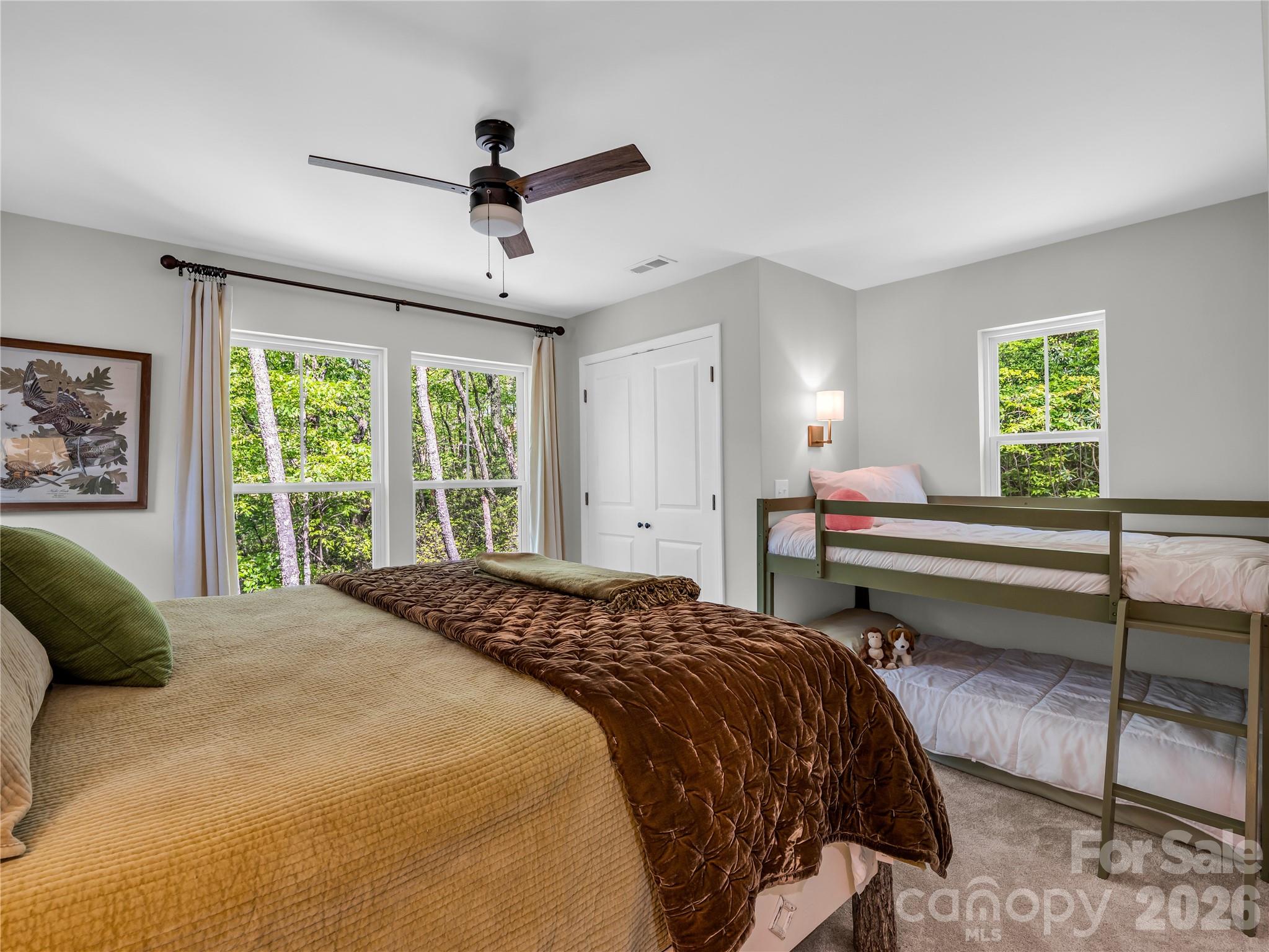 737 Melrose Mountain Road Tryon, NC 28782 - Photo 28 of 42 a bedroom with a bed and a window