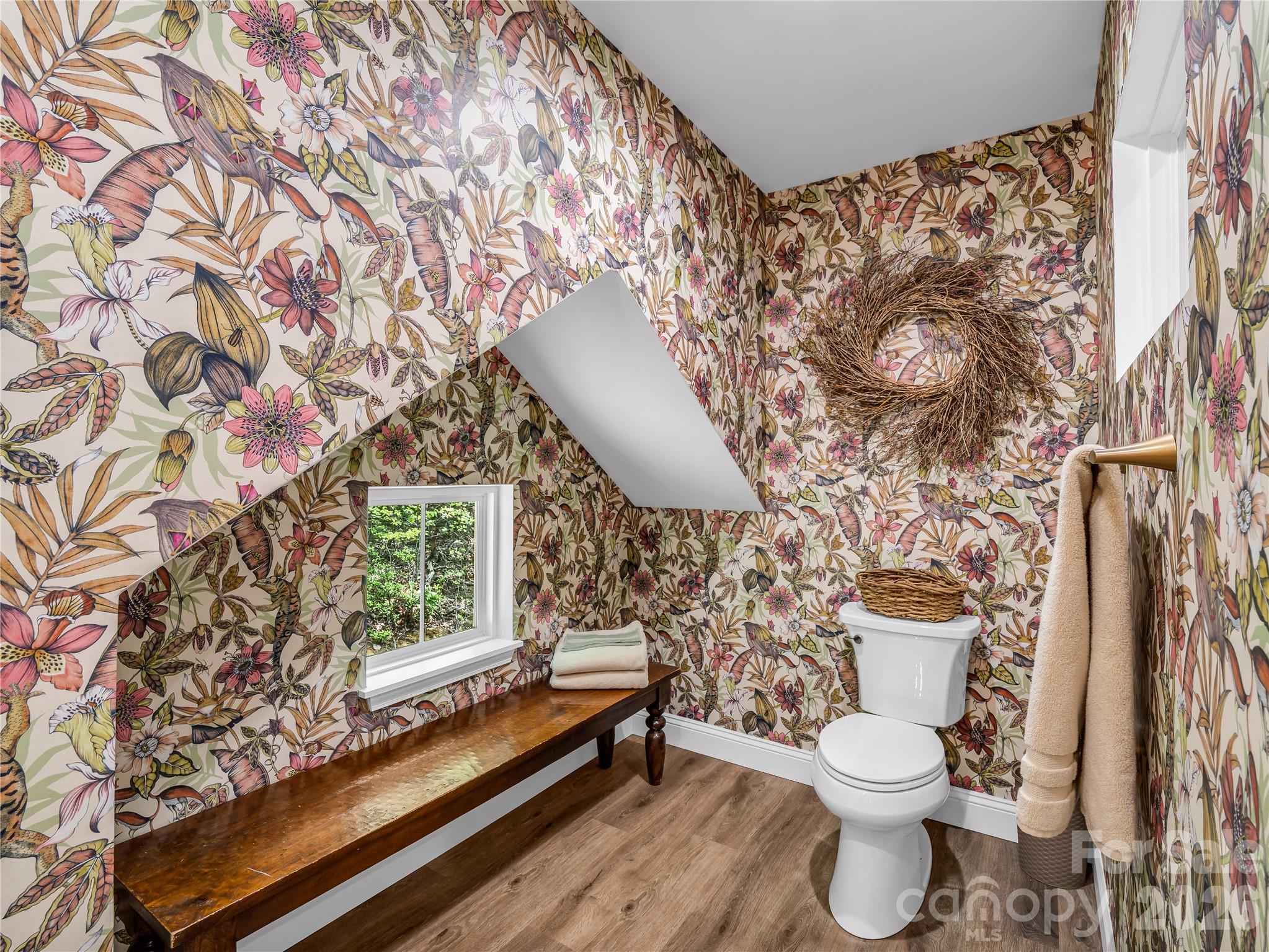 737 Melrose Mountain Road Tryon, NC 28782 - Photo 29 of 42 a white toilet sitting next to a shower curtain