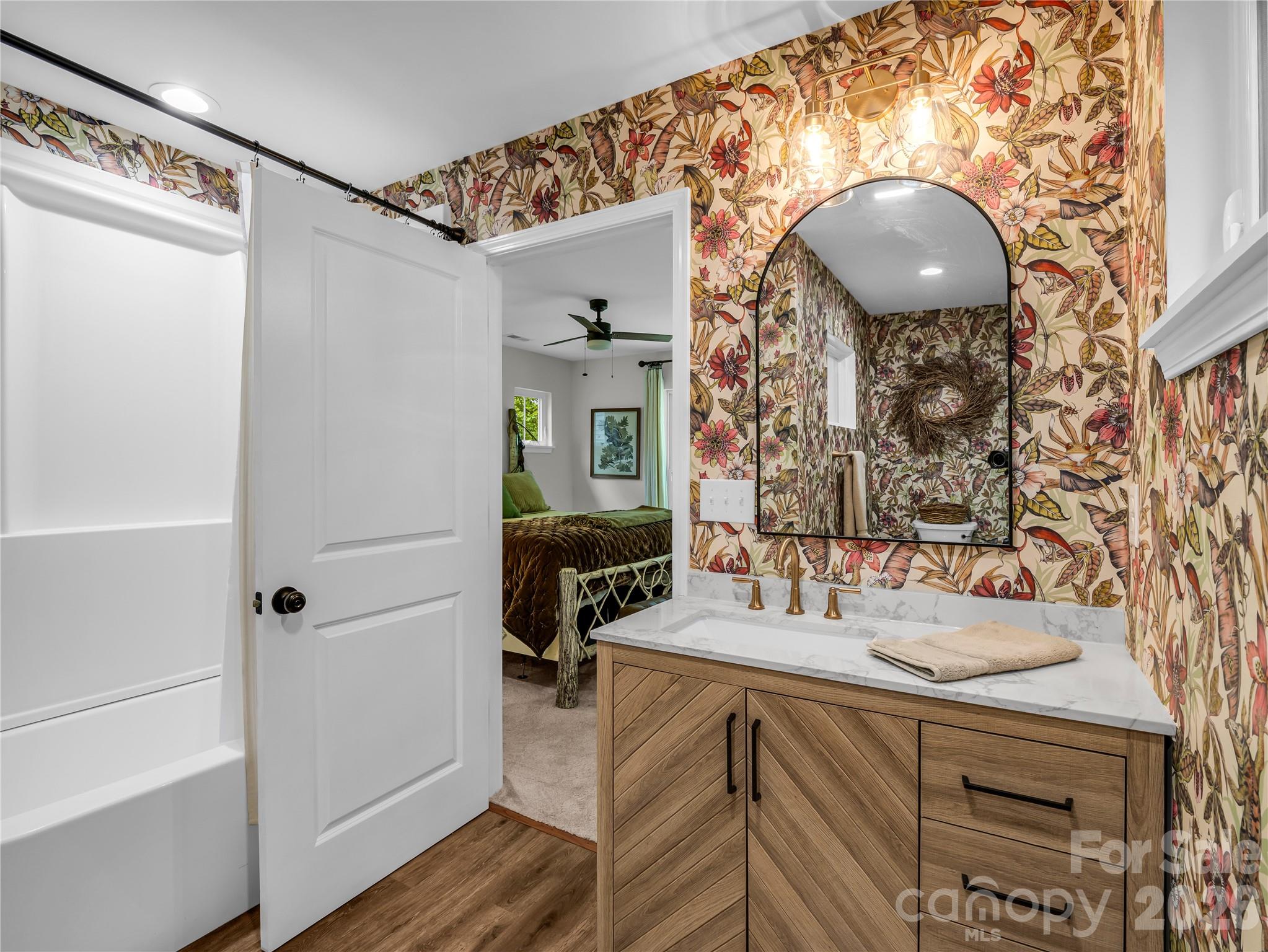 737 Melrose Mountain Road Tryon, NC 28782 - Photo 30 of 42 a bathroom with a sink and a mirror
