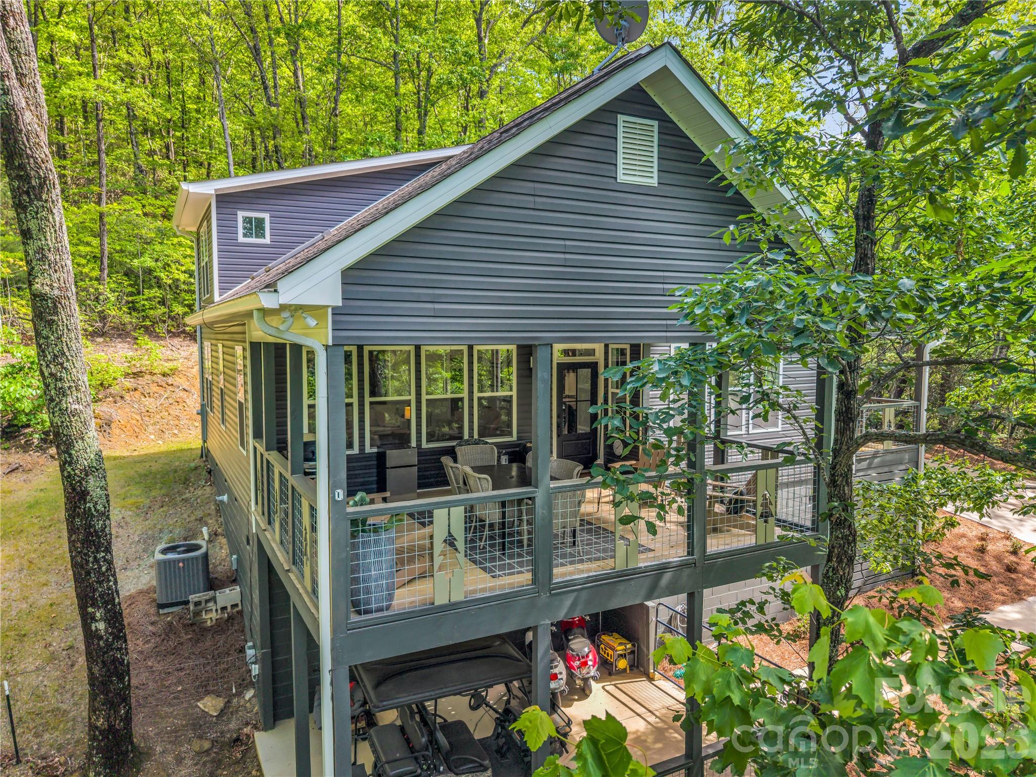 737 Melrose Mountain Road Tryon, NC 28782 - Photo 3 of 42 front view of a house with a yard