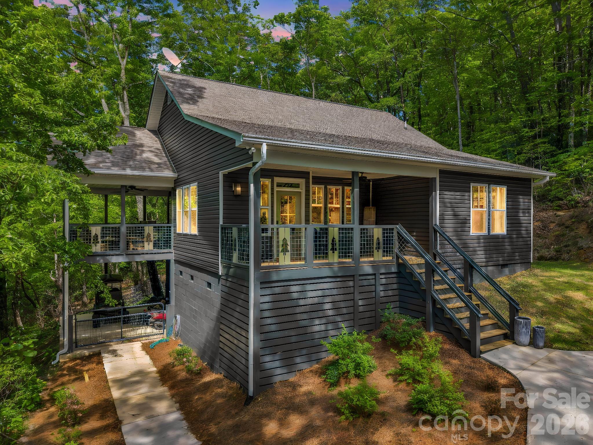 737 Melrose Mountain Road Tryon, NC 28782 - Photo 36 of 42 a front view of a house with a porch
