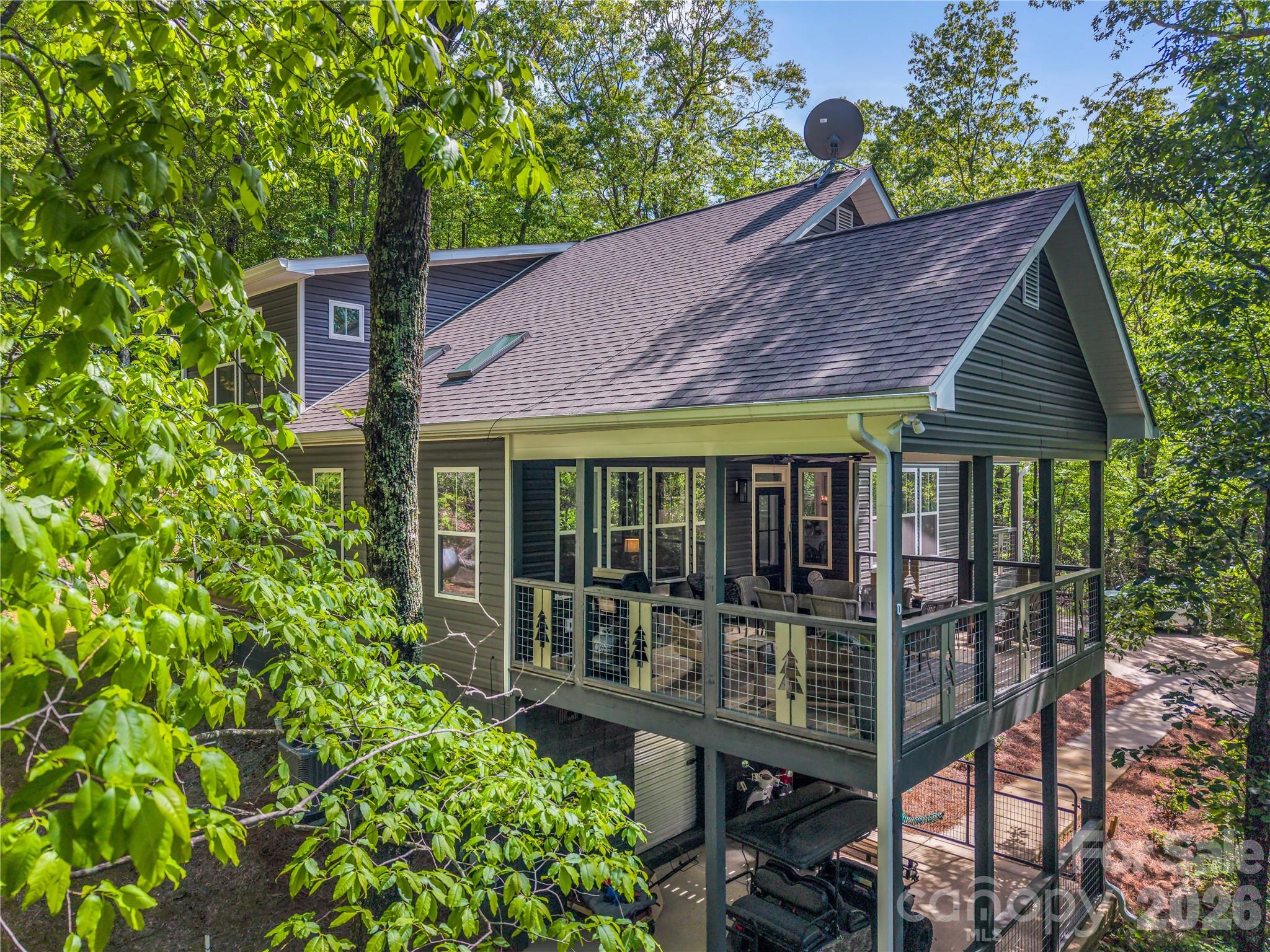 737 Melrose Mountain Road Tryon, NC 28782 - Photo 4 of 42 a front view of a house with balcony