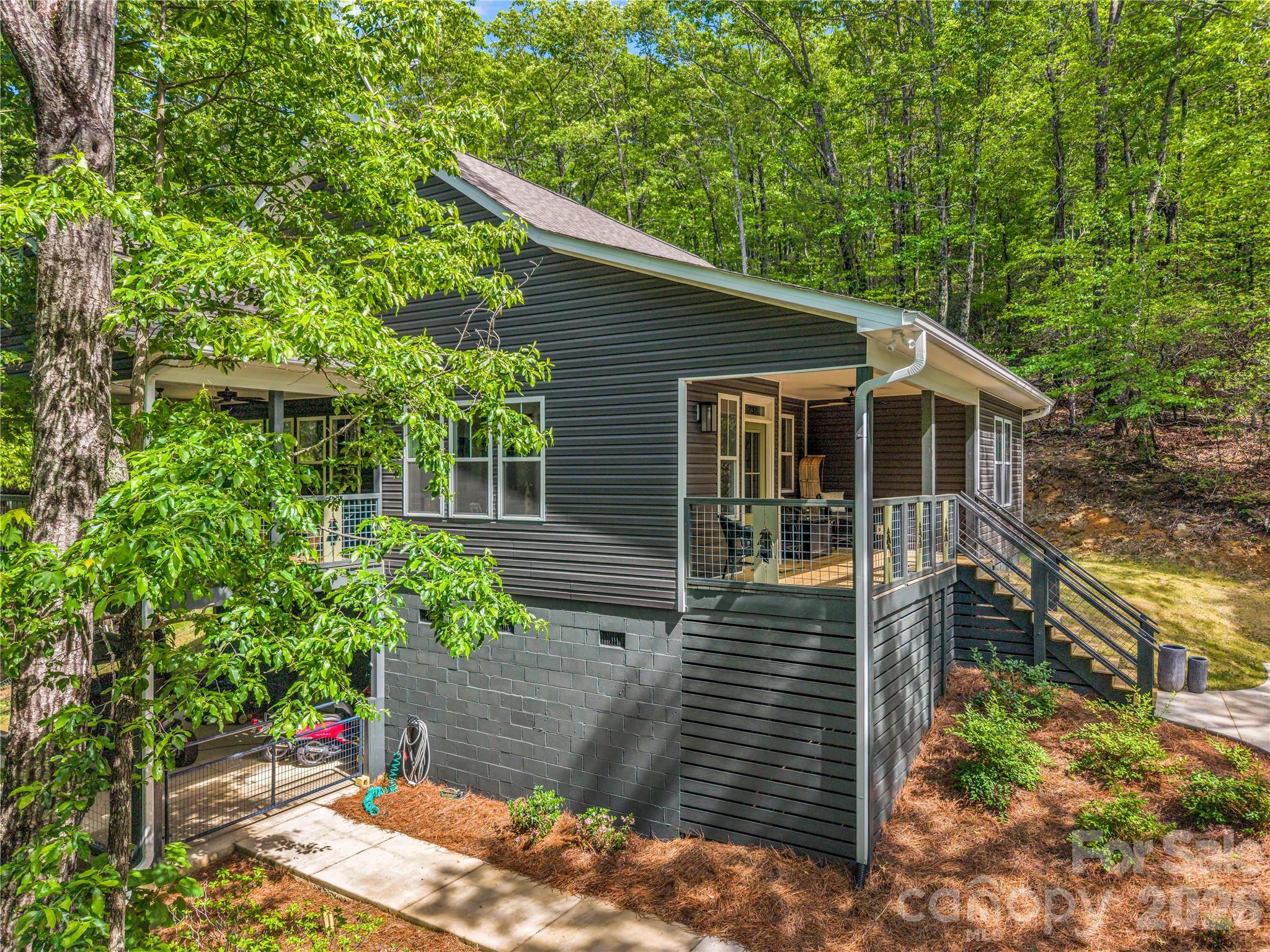 737 Melrose Mountain Road Tryon, NC 28782 - Photo 5 of 42 a view of a house with a yard