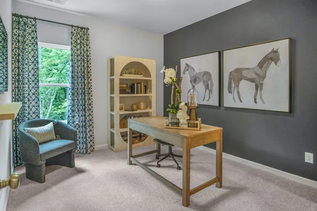 a view of a livingroom with furniture and window