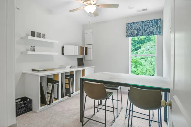 a view of a dining room with furniture window and outside view