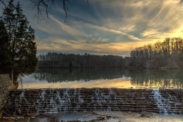 a view of swimming pool with a lake