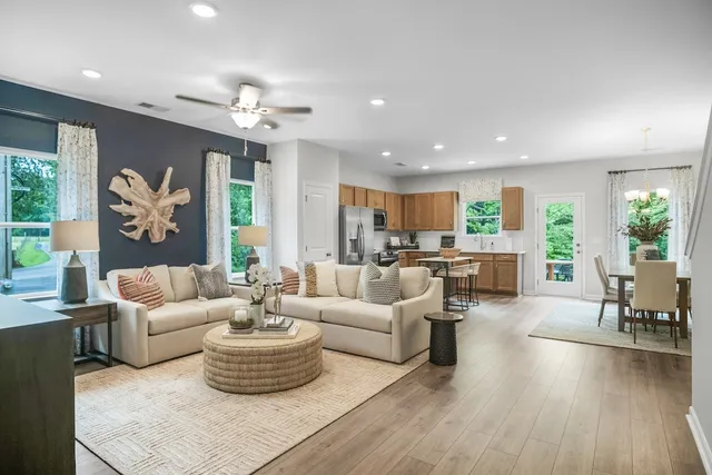 a living room with furniture or kitchen and a chandelier