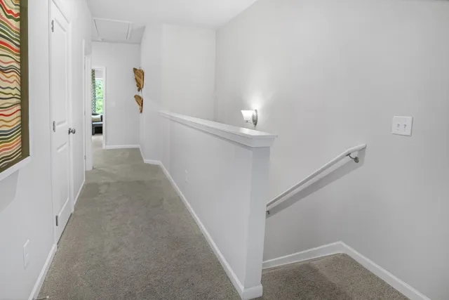a view of a hallway with white walls