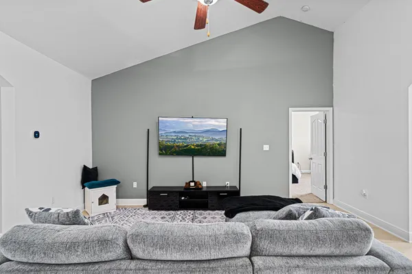 a living room with furniture and a flat screen tv