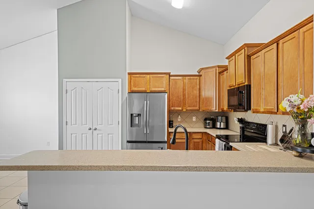 a view of a living room hardwood floor and a fireplace